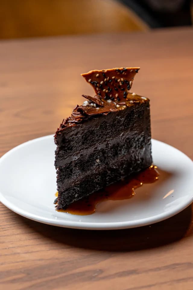 Slice of chocolate cake with caramel sauce