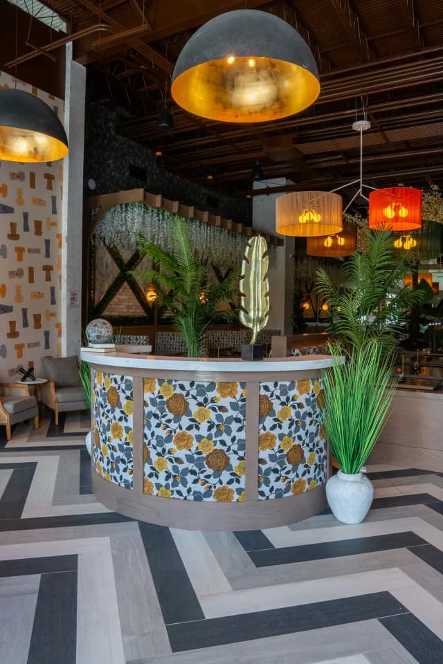 The curved tiled bar and chevron floor at Suwanee Social