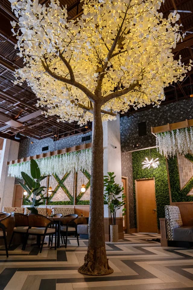 Illuminated blossom tree in the Suwanee Social dining room