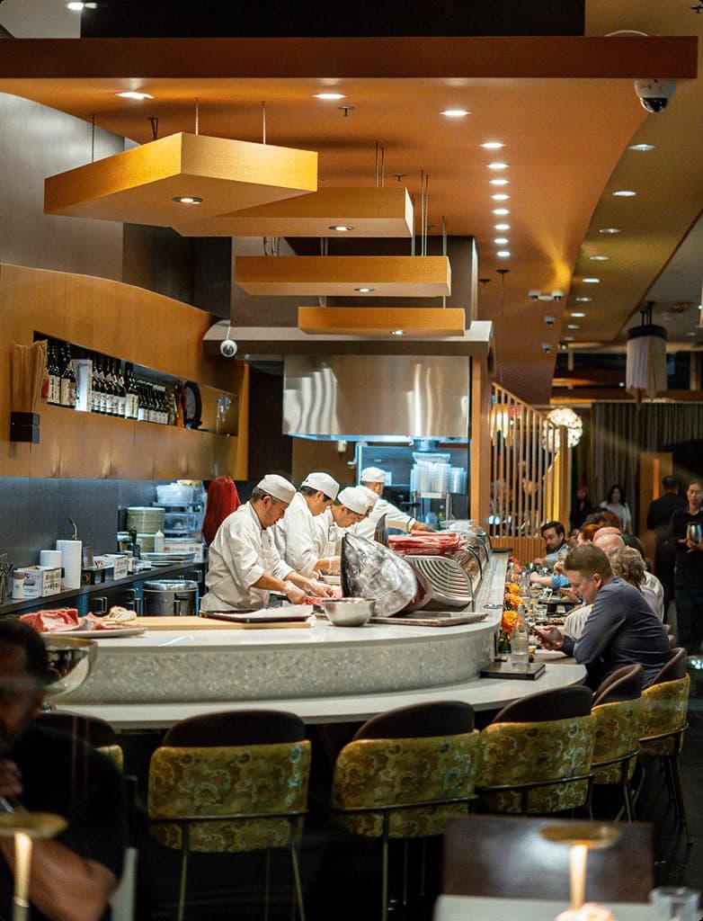 The sushi counter at Tomo Japanese, with chefs working the bar