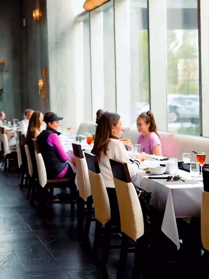 The dining room at Tomo Japanese, along its floor-to-ceiling windows